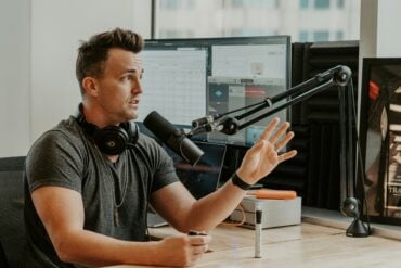 Contractor handling business calls while podcasting
