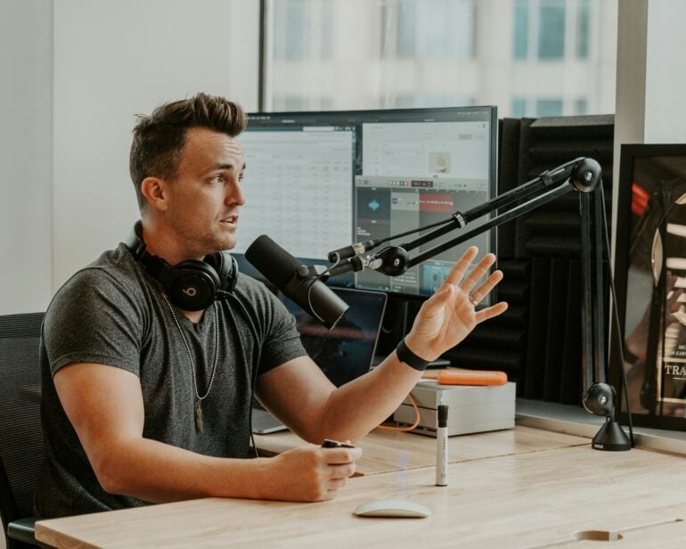 Contractor handling business calls while podcasting